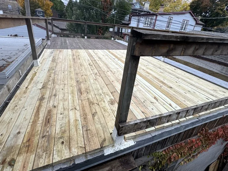 Completed rooftop deck with new wooden boards in Chicago